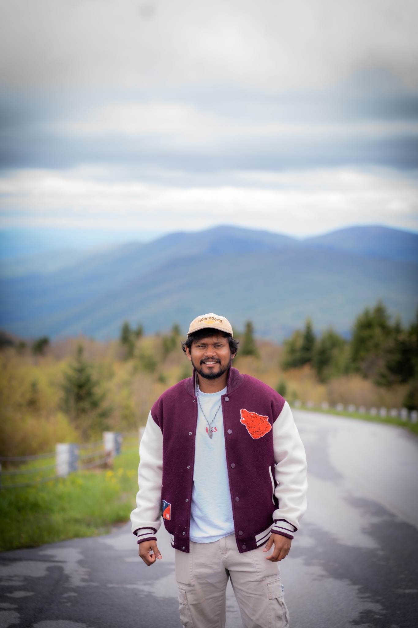 Ripan standing at a mountain overlook