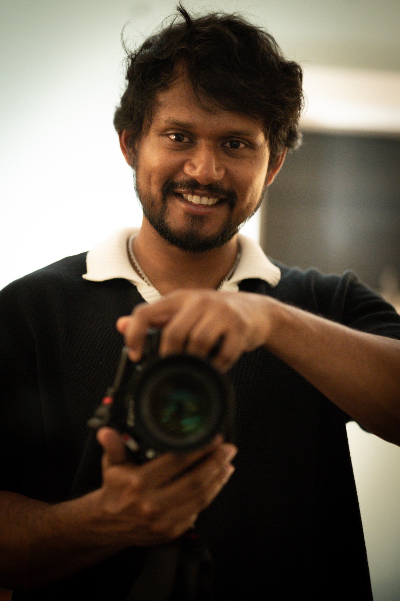Ripan holding a camera
